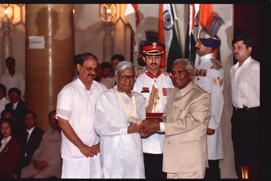 An award being presented at a formal ceremony