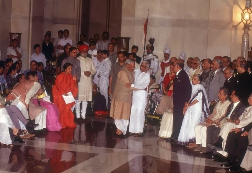 Guests greeting one another at a formal ceremony